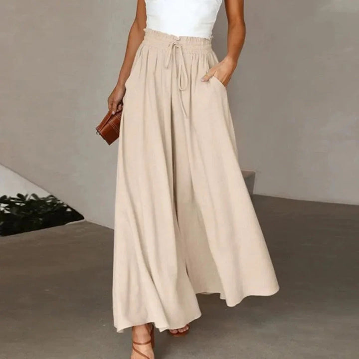 Casual yet elegant women's high-waisted wide leg pants, smocked drawstring for comfort & effortless style.