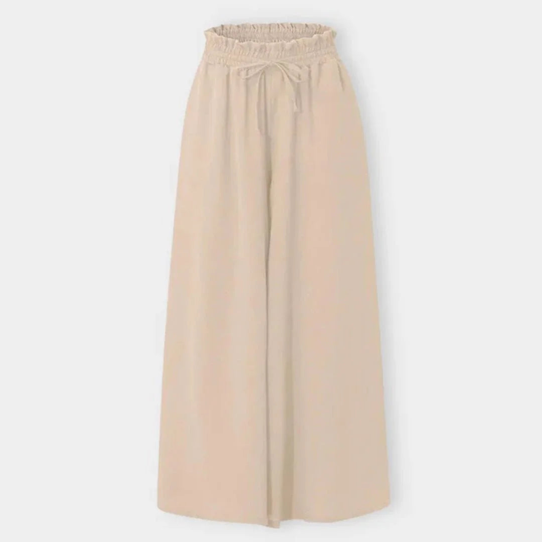 Loose fit women's high-waisted wide leg pants, comfortable smocked drawstring for ultimate flowy movement.