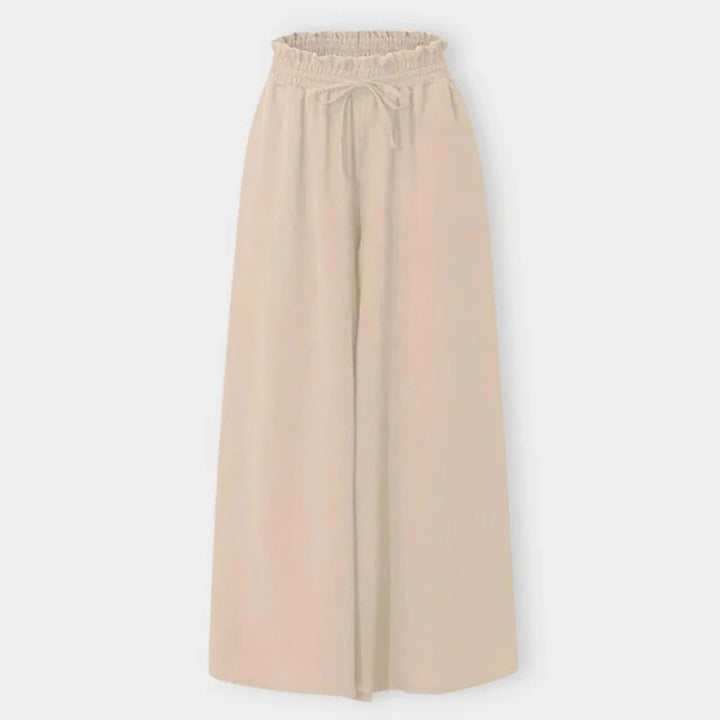 Loose fit women's high-waisted wide leg pants, comfortable smocked drawstring for ultimate flowy movement.