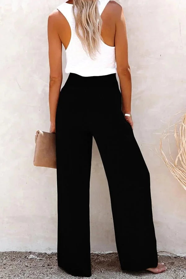 Chic women's wide-leg trousers featuring a flattering high waist and stylish smocked button front design.
