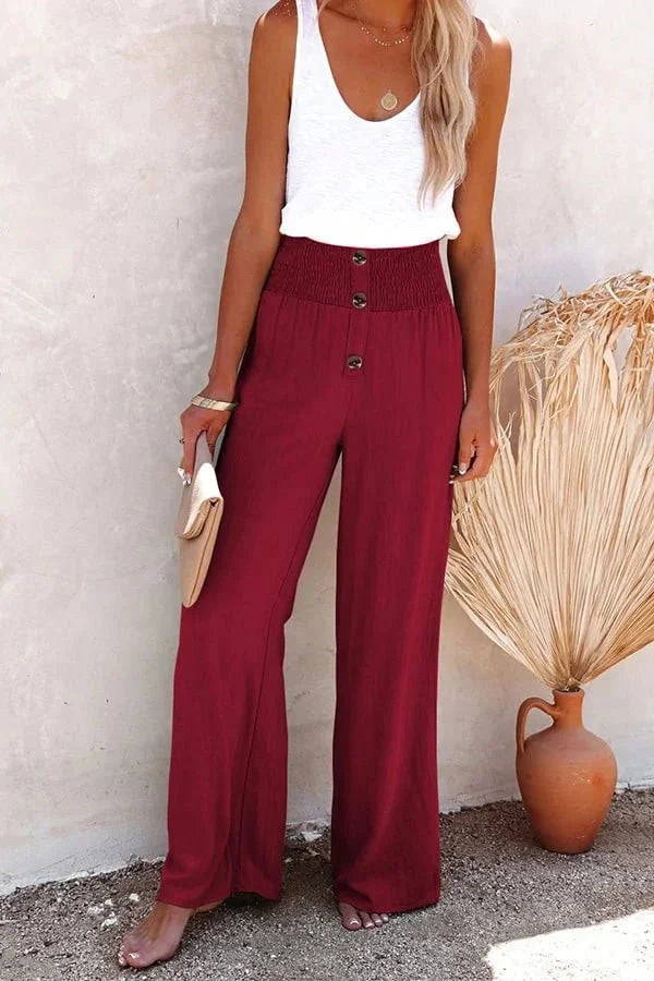 Lightweight women's summer trousers, high-waisted wide-leg design with unique smocked button details.