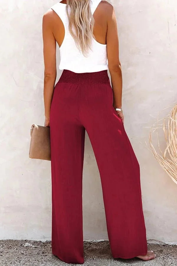 Flattering high-waisted wide-leg trousers for women, designed with a comfortable smocked button front.