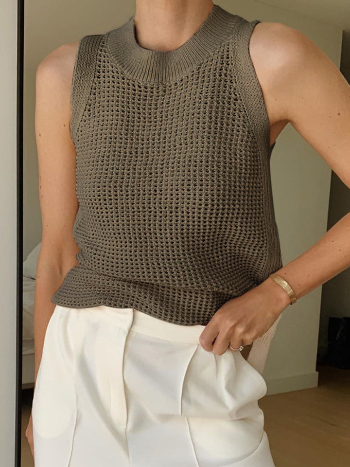 Breezy women's tank top featuring a unique hollow design, great for warm weather and versatile styling.