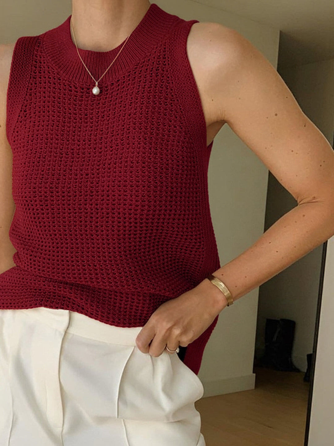 Stylish women's tank top with an intricate hollow design, perfect for summer casual and vacation outfits.