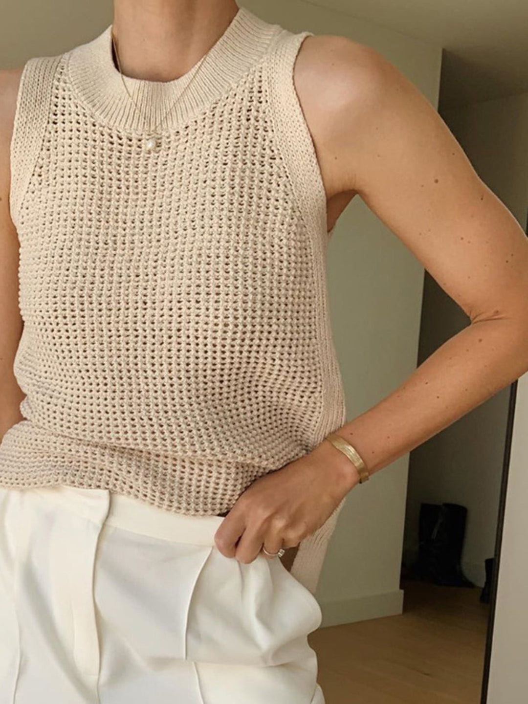 Comfortable women's sleeveless top, featuring an elegant hollow design for a breezy and versatile look.