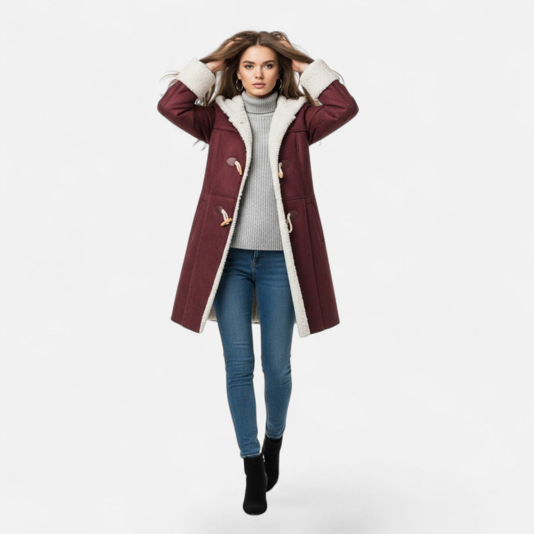 Stay warm in this women's elegant winter coat with a flattering hooded design.