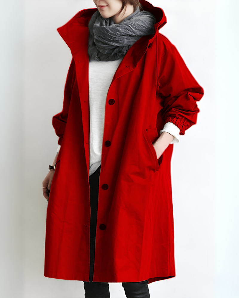 A women's hooded trench coat in a deep green, ideal for winter