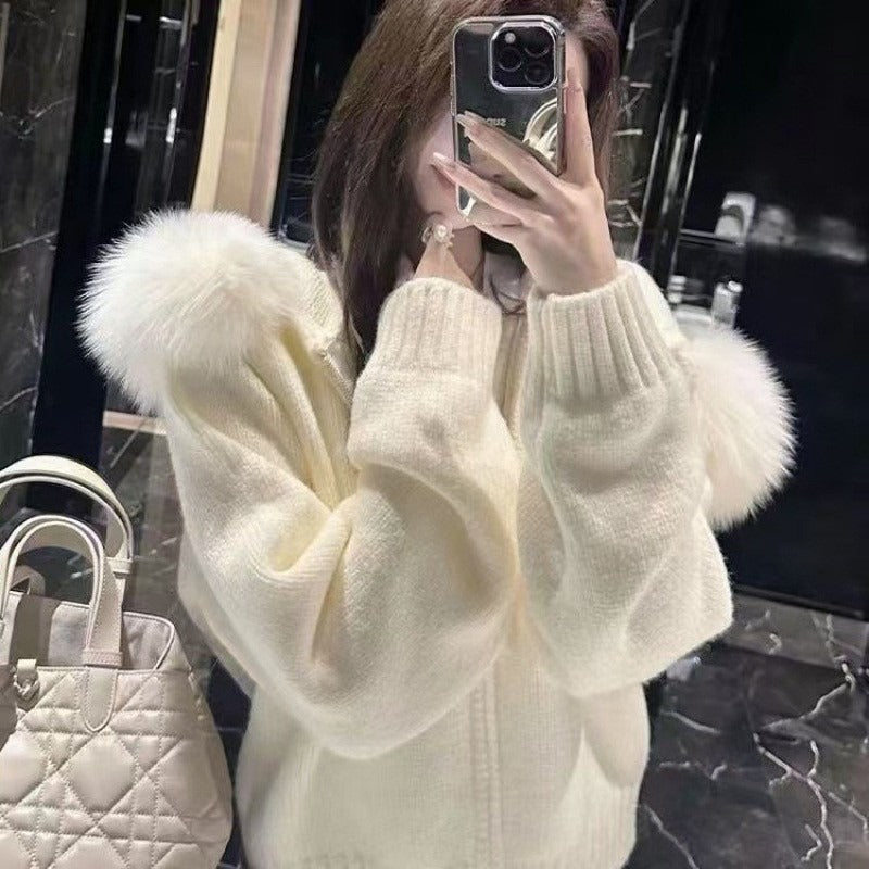Women's hooded knit jacket with luxurious fur collar, perfect for cozy winter style.