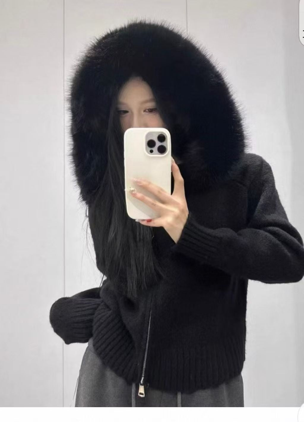Chic and trendy women's knit jacket featuring a warm fur collar and hood for elegant outerwear.