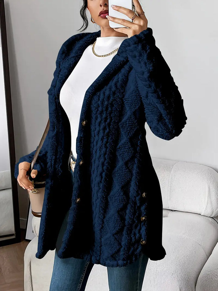 Soft textured knit women's hooded longline cardigan. Casual button-front style, comfortable for cool weather.