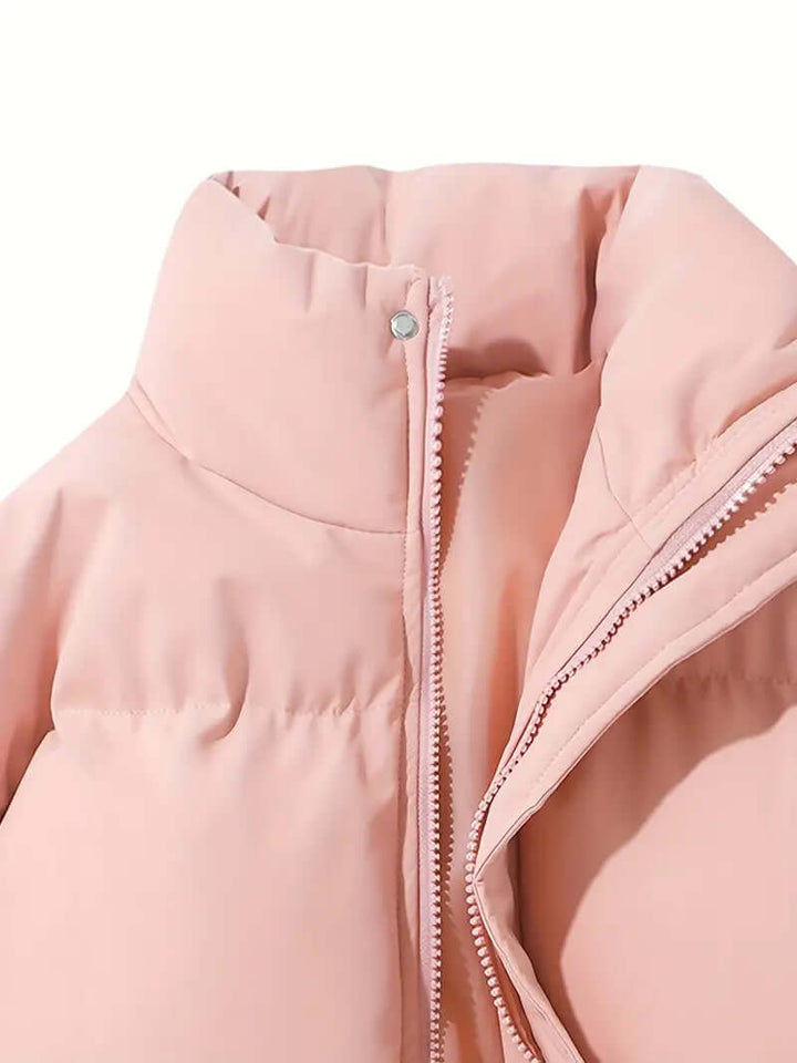 Stylish women's hooded puffer jacket, modern outerwear for a chic winter look.