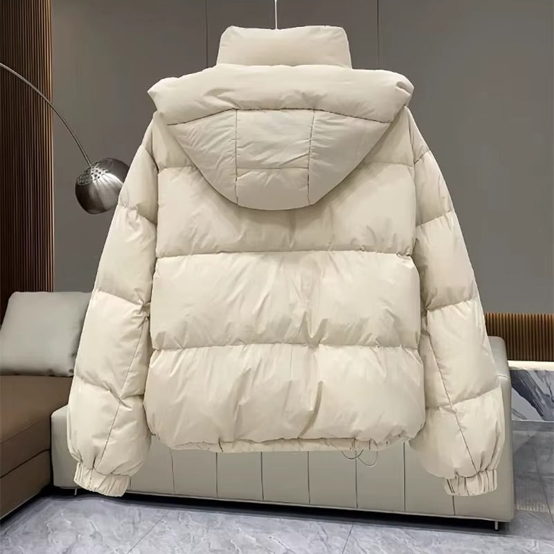 Weather-resistant women's hooded puffer coat, high neck shields from wind & cold in winter.