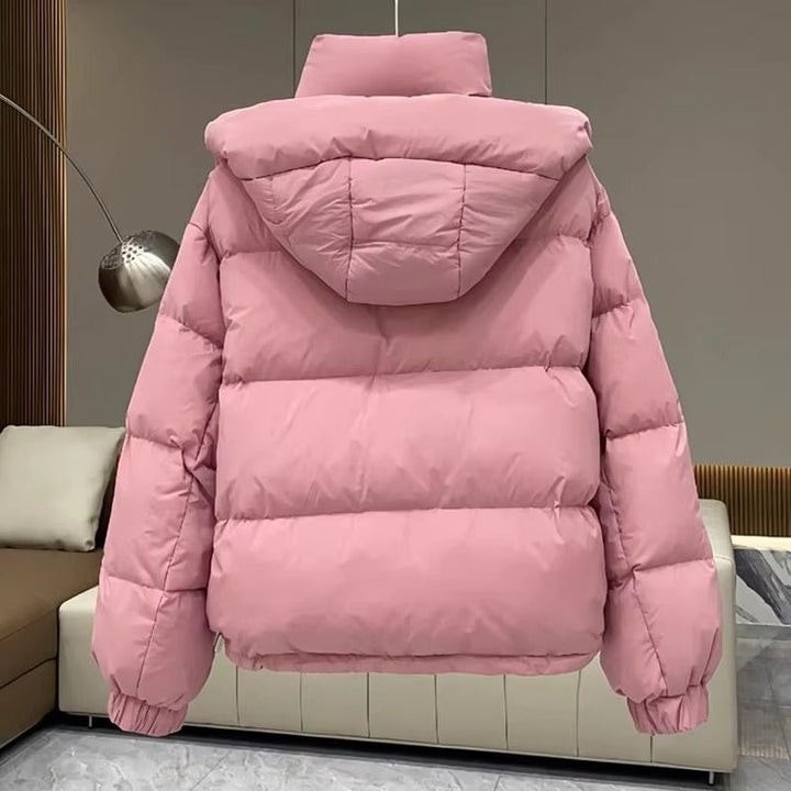 Women's insulated hooded puffer jacket with high neck, a cozy & stylish winter fashion essential.