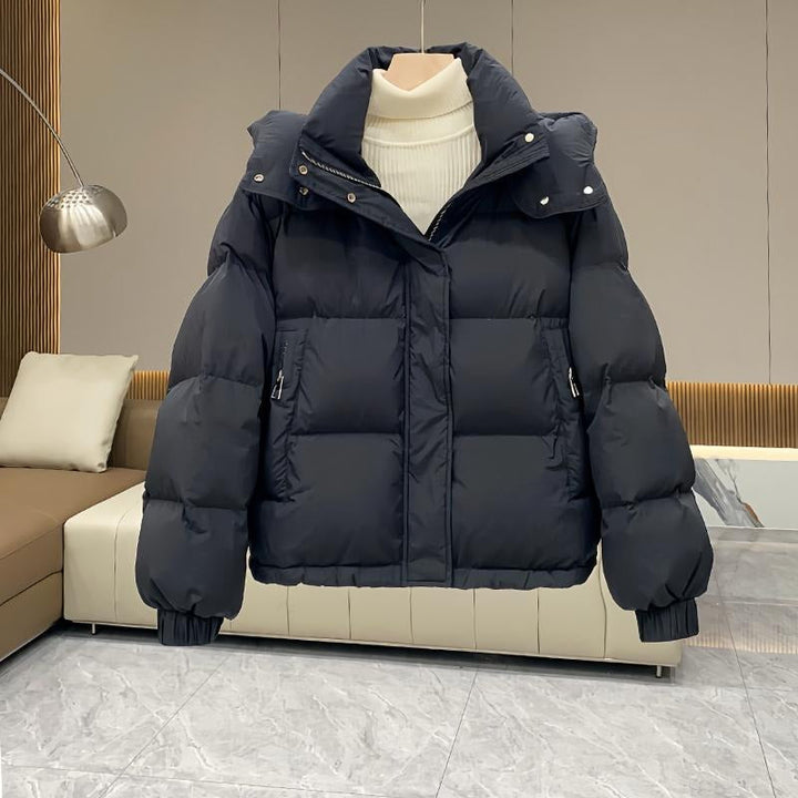 Insulated women's puffer coat, hooded with high neck, ideal for fall & winter outerwear.