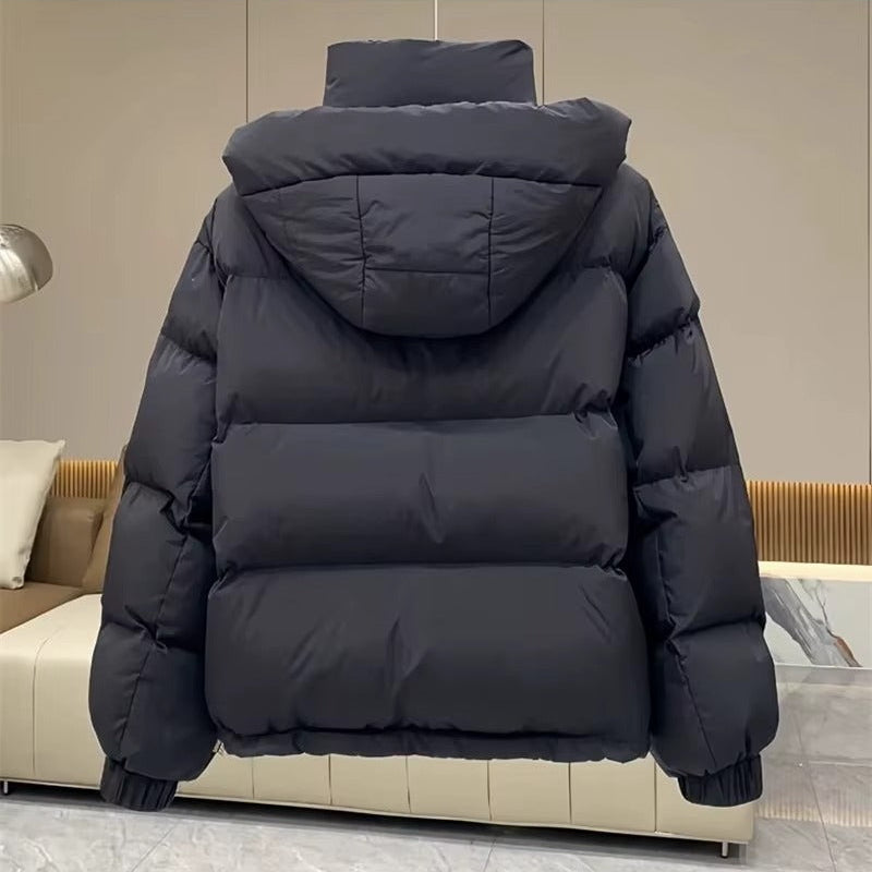 Stylish women's hooded puffer jacket, high neck design, great for winter fashion & outdoor wear.
