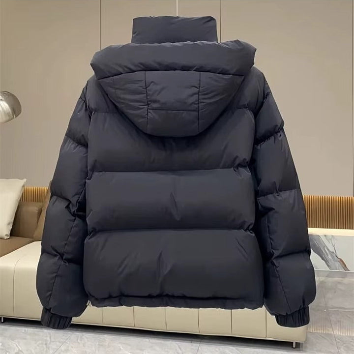 Stylish women's hooded puffer jacket, high neck design, great for winter fashion & outdoor wear.
