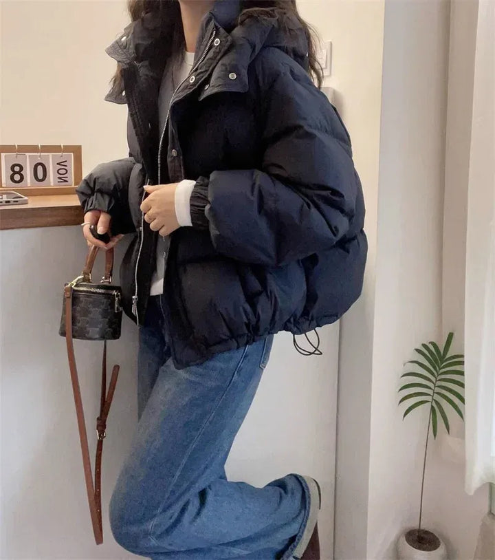 Fall & winter women's hooded puffer jacket, high neck for ultimate warmth & style.