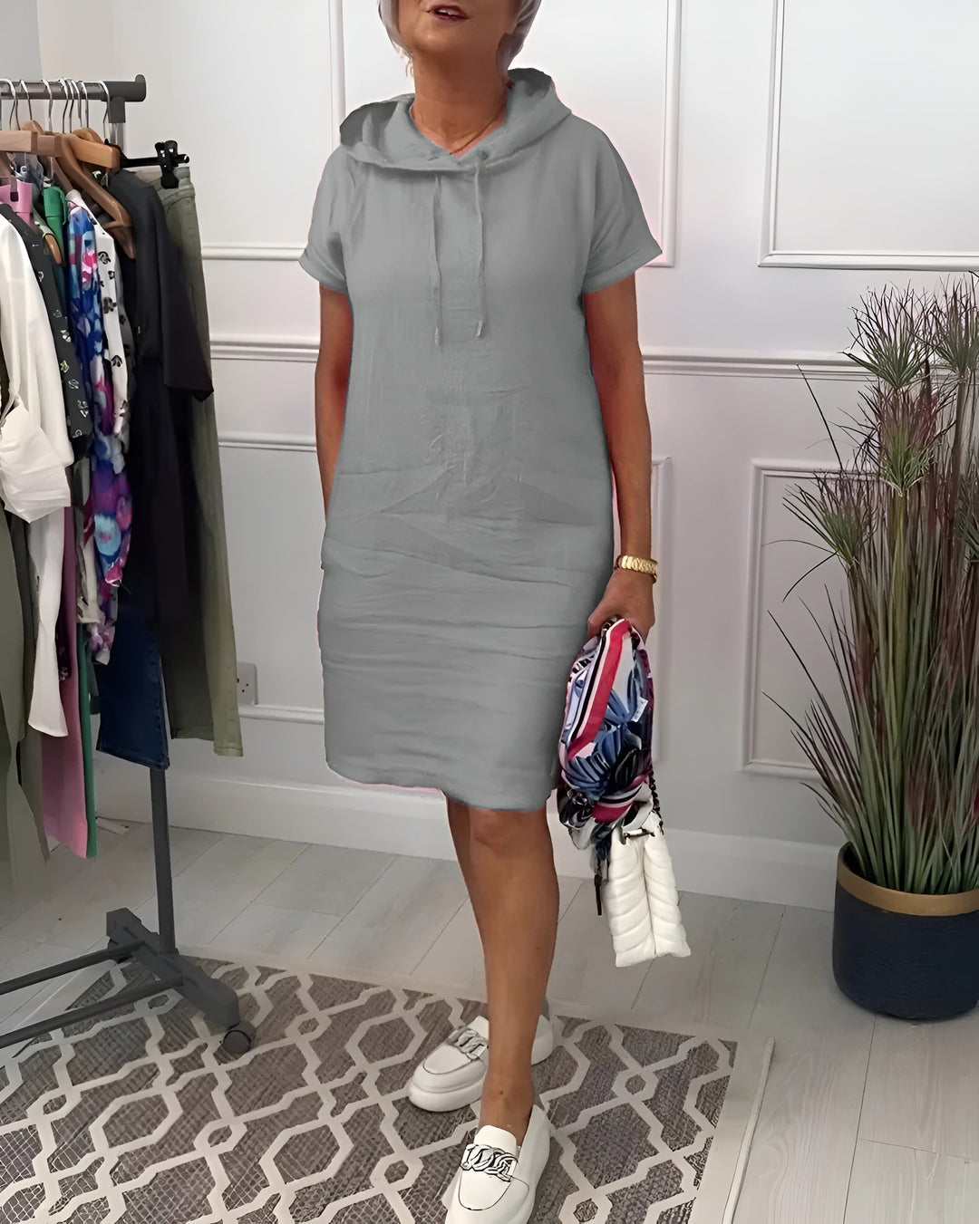 Full length shot of women's knee-length hooded short sleeve dress, ideal for casual comfort.