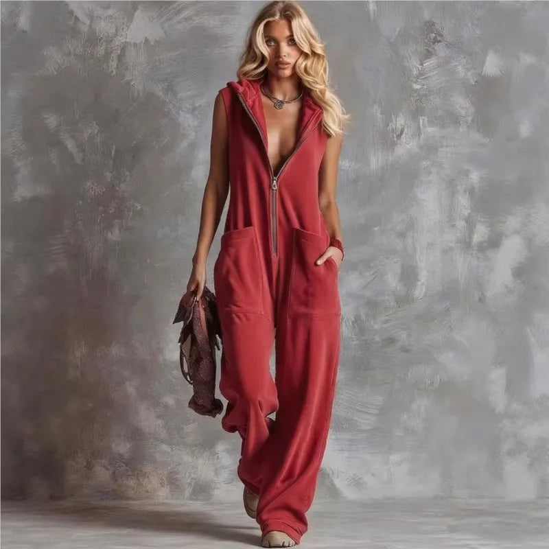 Chic women's wide-leg jumpsuit, hooded & sleeveless, with a zipper & convenient pockets. Great for casual comfort.