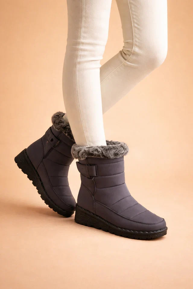 Warm women's insulated snow boots, featuring grippy soles for excellent traction in winter.