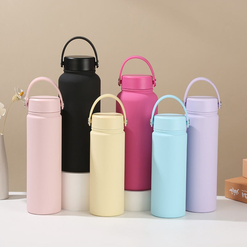 Women's insulated stainless steel water bottle with ergonomic handle for gym & travel hydration.