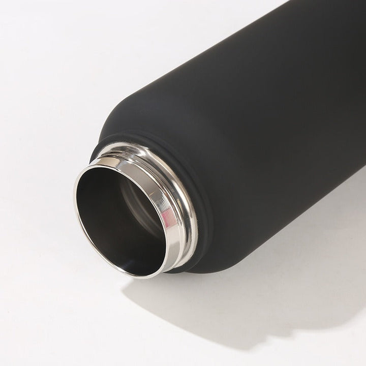 Stylish women's insulated water bottle for sport, gym, and everyday hydration. Features ergonomic carry handle.