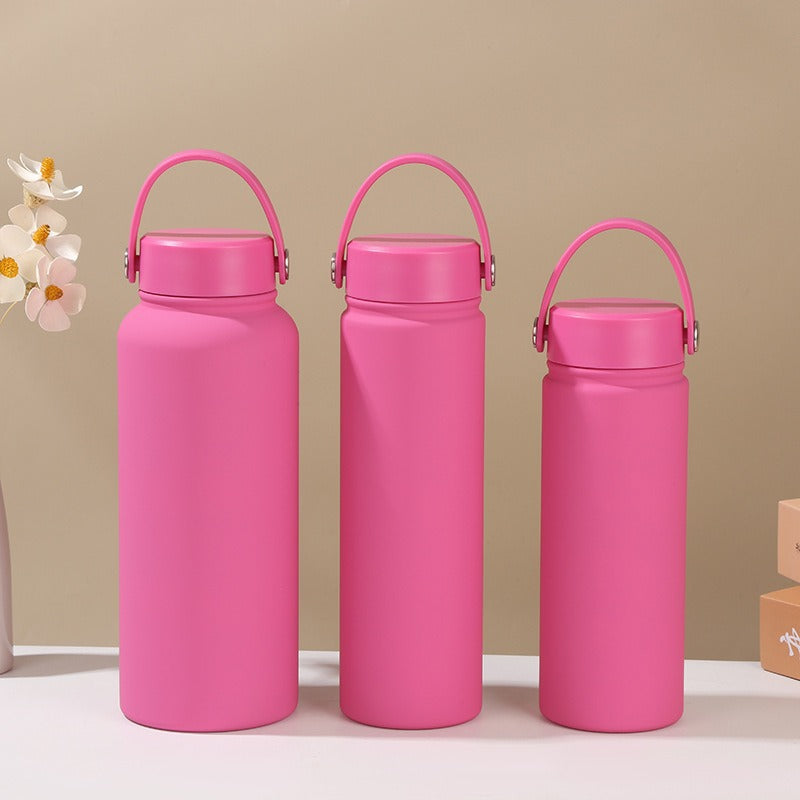 Women's insulated flask with ergonomic handle, keeps hot drinks hot & cold drinks cold. Leak-proof design.