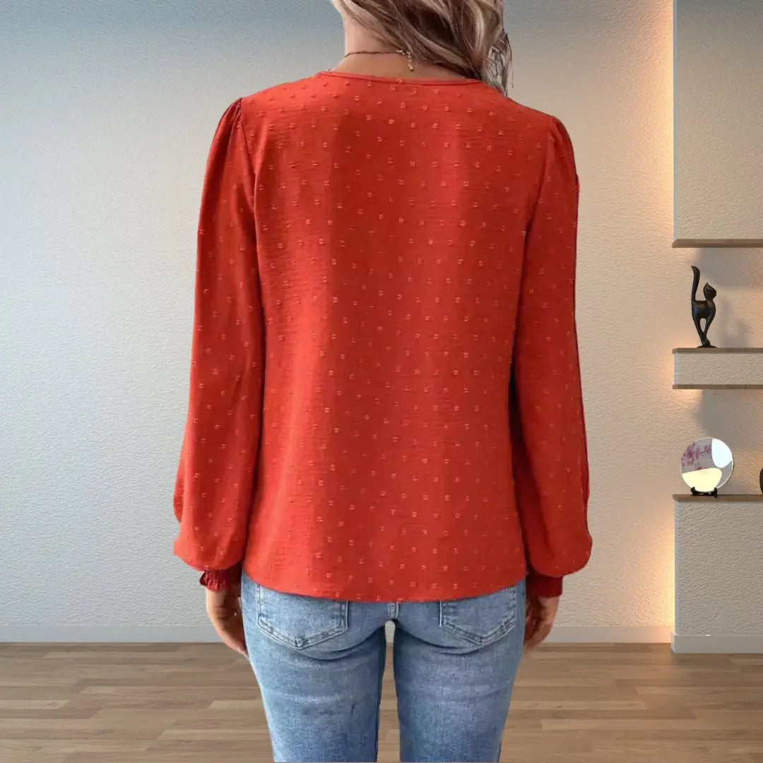 Elegant women's flowy blouse with intricate vintage-inspired pattern, V-neck, long sleeves & lace.