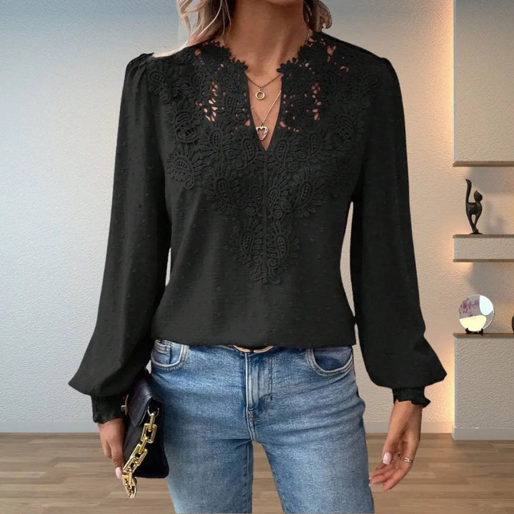Romantic women's long sleeve V-neck blouse featuring intricate pattern, delicate lace & smocked cuffs.