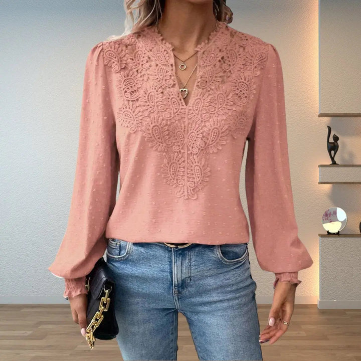 Stylish women's blouse, intricate pattern, V-neck, long sleeves with smocked cuffs & delicate lace.