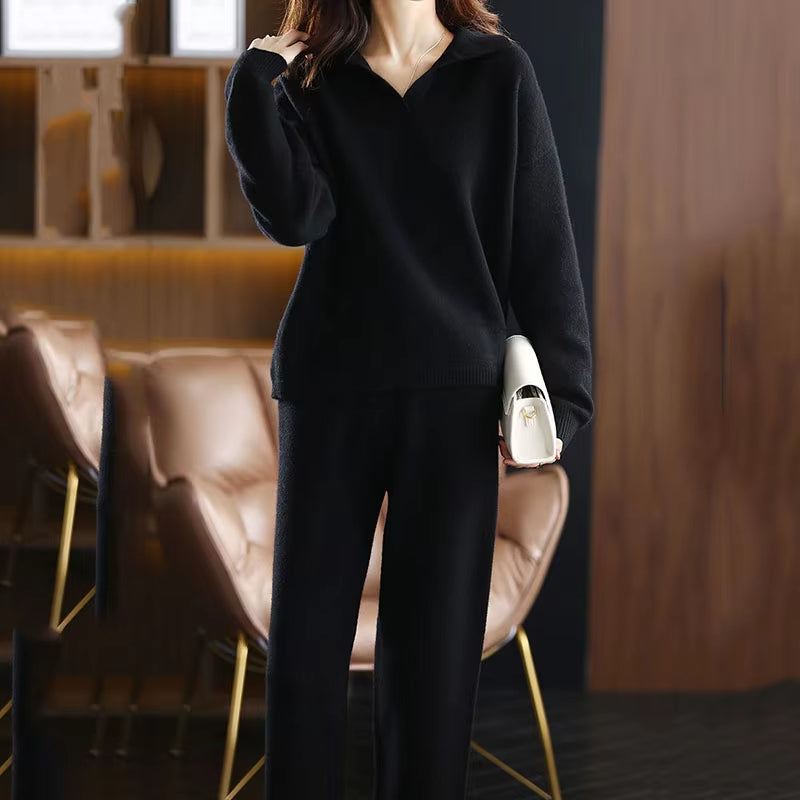 Stylish women's black cashmere set with a relaxed fit, showcasing soft comfort and knitwear detail.