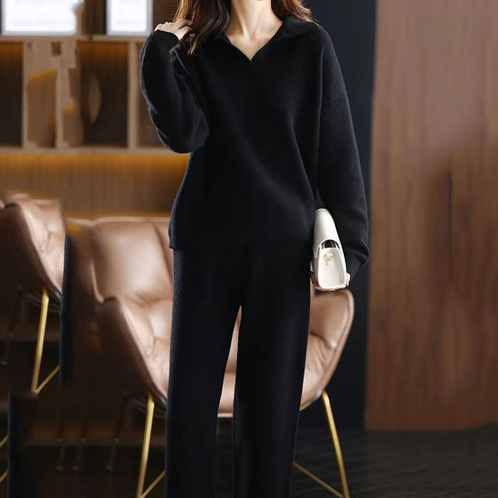 Stylish women's black cashmere set with a relaxed fit, showcasing soft comfort and knitwear detail.