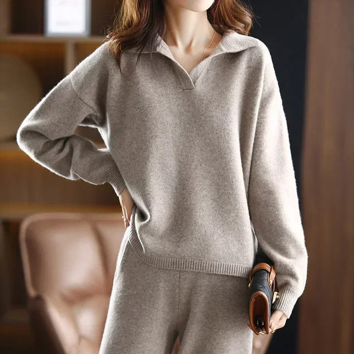 Close-up of soft ivory cashmere fabric from women's two-piece set, highlighting luxurious texture.