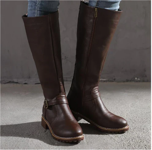 Elegant women's knee high flat boots with buckle straps, ideal for winter fashion & comfort.