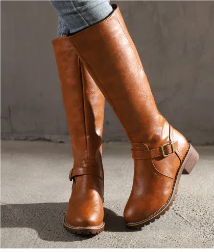 Fashionable women's knee-high flat heel boots, featuring decorative buckle straps for a chic look.