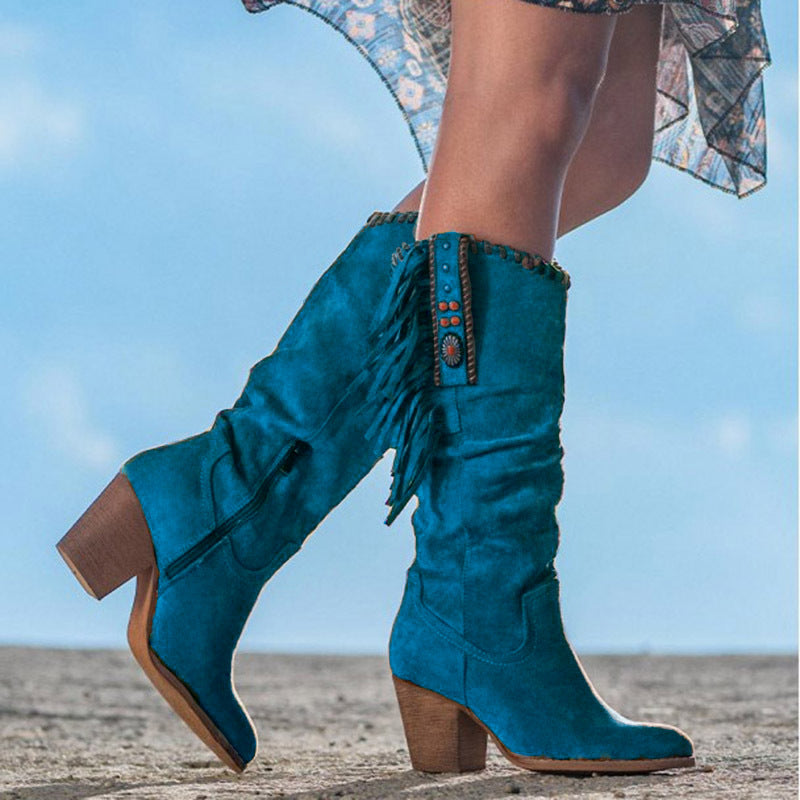 Fashionable women's knee-high fringe cowboy boots featuring a stable block heel for all-day comfort.