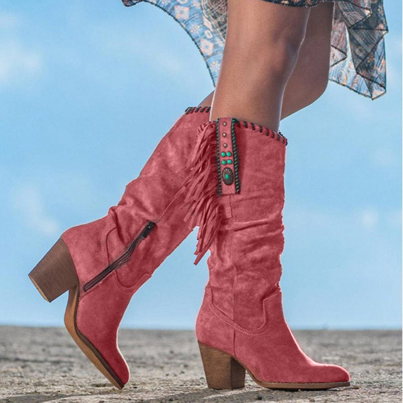 Western-style women's fringe cowboy boots with block heel & turquoise accent, great for fall/winter outfits.