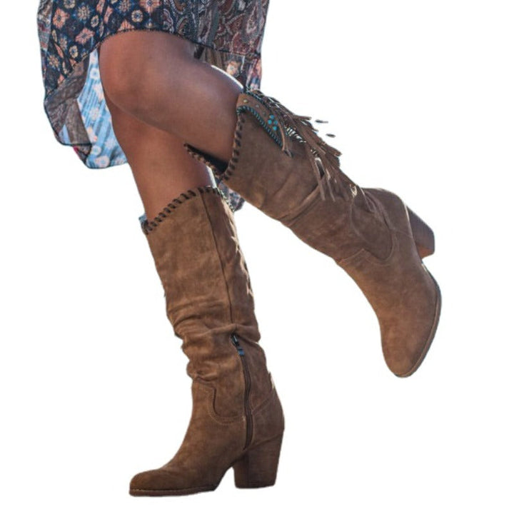 Elegant women's fringe cowboy boots with a comfortable block heel for versatile western & festival fashion.