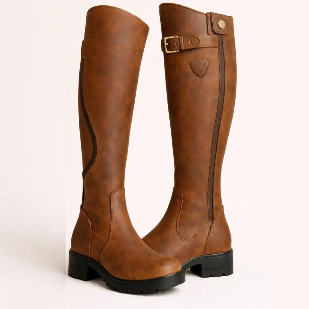 Women's knee high waterproof boots with side zip. Ideal for winter & autumn, providing weather-resistant comfort.