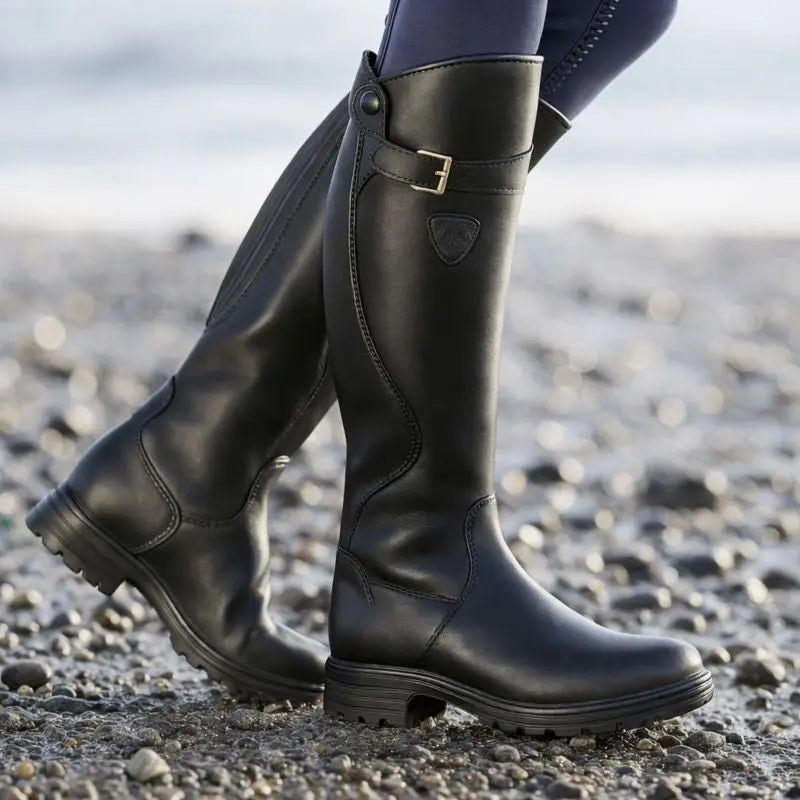 Stylish women's knee high waterproof boots. Casual yet elegant, with a functional side zip for easy wear in wet weather.