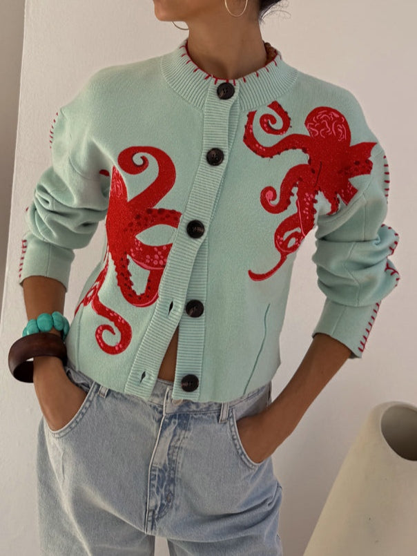 Women's knit cardigan with unique octopus pattern, button front. Ideal for casual wear.