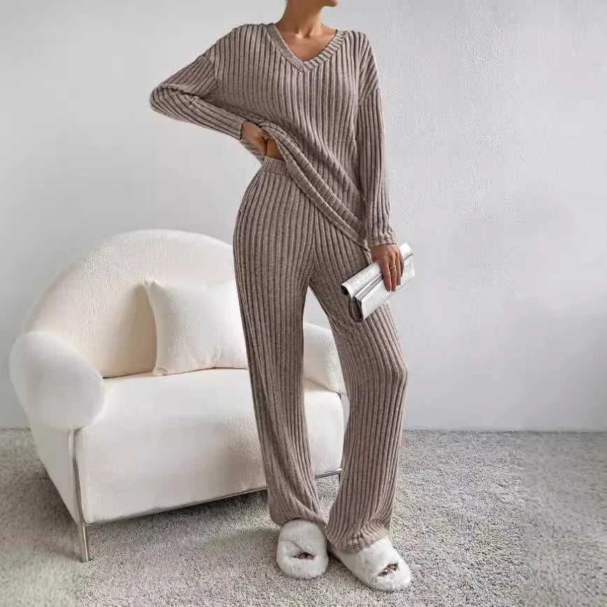 Chic women's knit loungewear set featuring a V-neck top & flattering wide leg pants.
