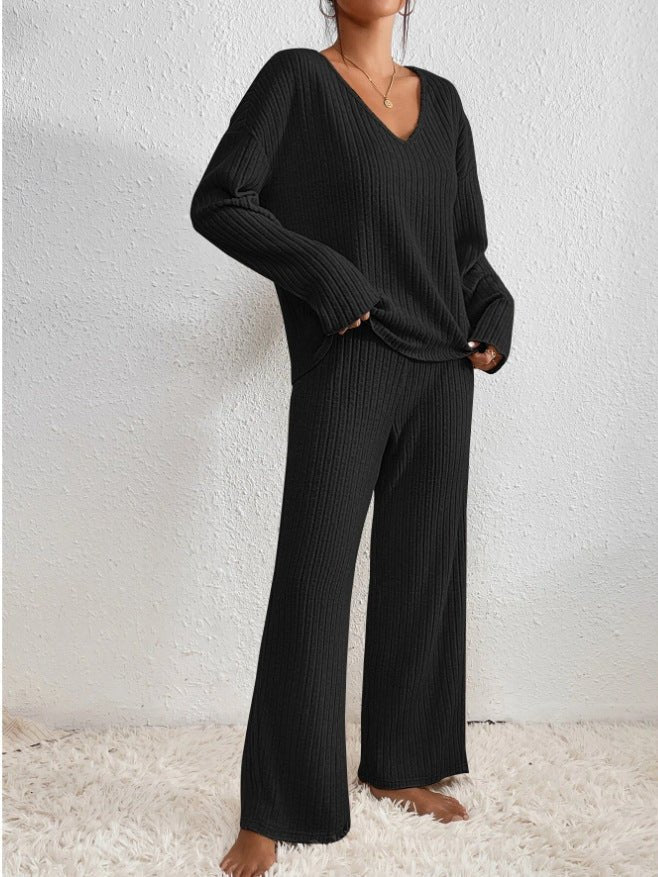 Casual women's two-piece knit loungewear set: soft V-neck top and comfy wide leg pants.