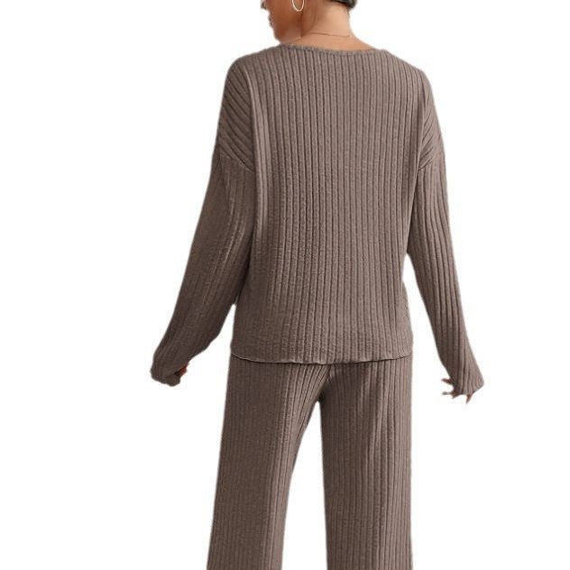 Soft knit women's loungewear set. V-neck long sleeve top and relaxed wide leg pants for cozy days.