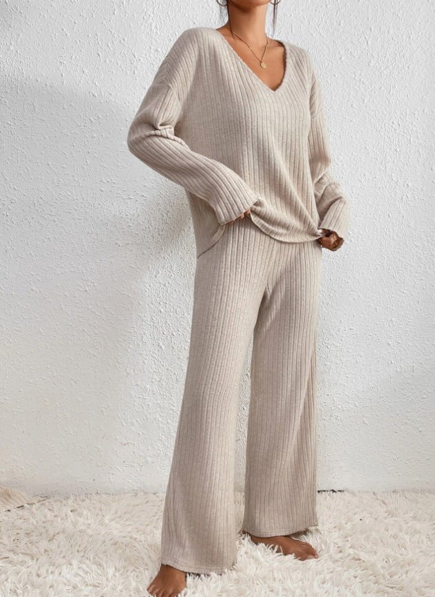 Women's cozy knit loungewear. Two-piece set with V-neck top and elegant wide leg pants.