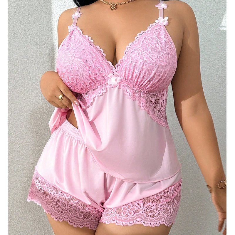 Comfortable women's two-piece satin feel pyjama set with lace detail shorts, ideal nightwear.