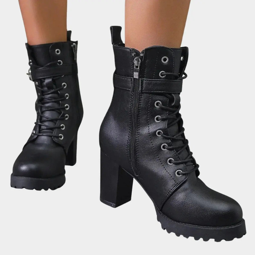 Stylish women's lace-up ankle boots with sturdy block heel, buckle strap, lug sole. Great for fall/winter.