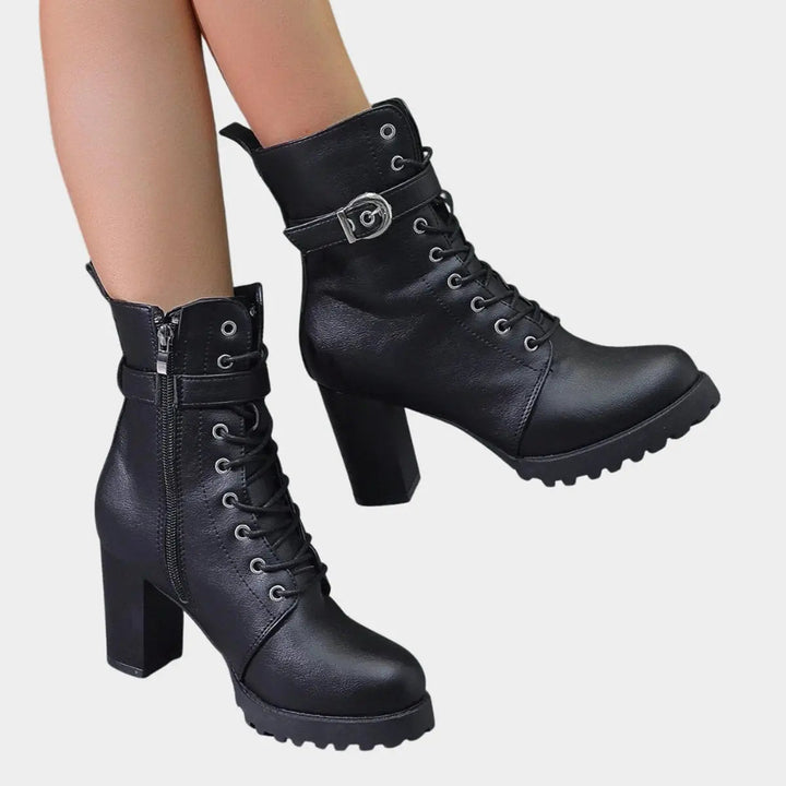 Fashion-forward women's block heel ankle boots. Lace-up design, buckle strap, chunky sole. Edgy style.
