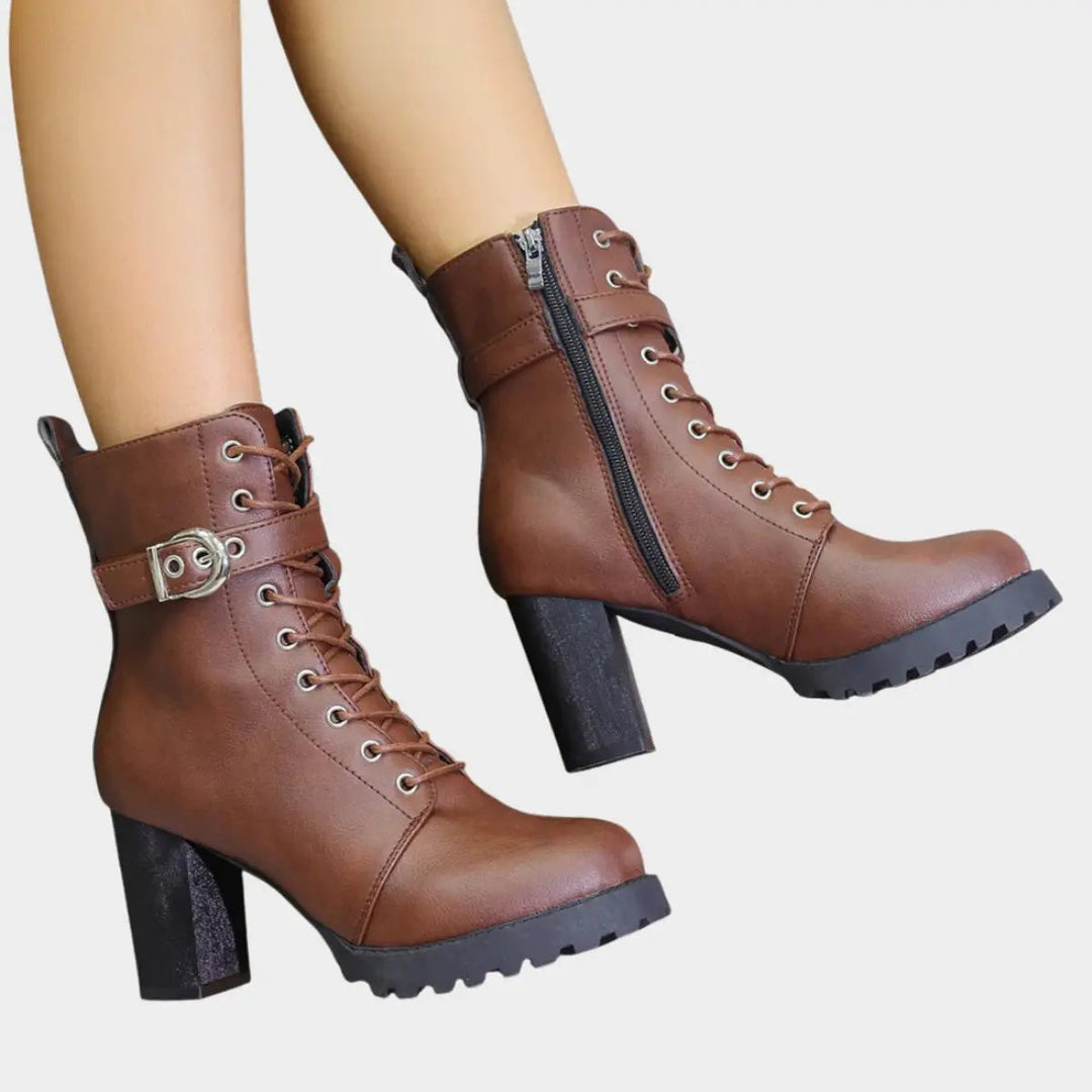 Women's fashion ankle boots with lace-up front, buckle strap & chunky block heel. Perfect for edgy looks.