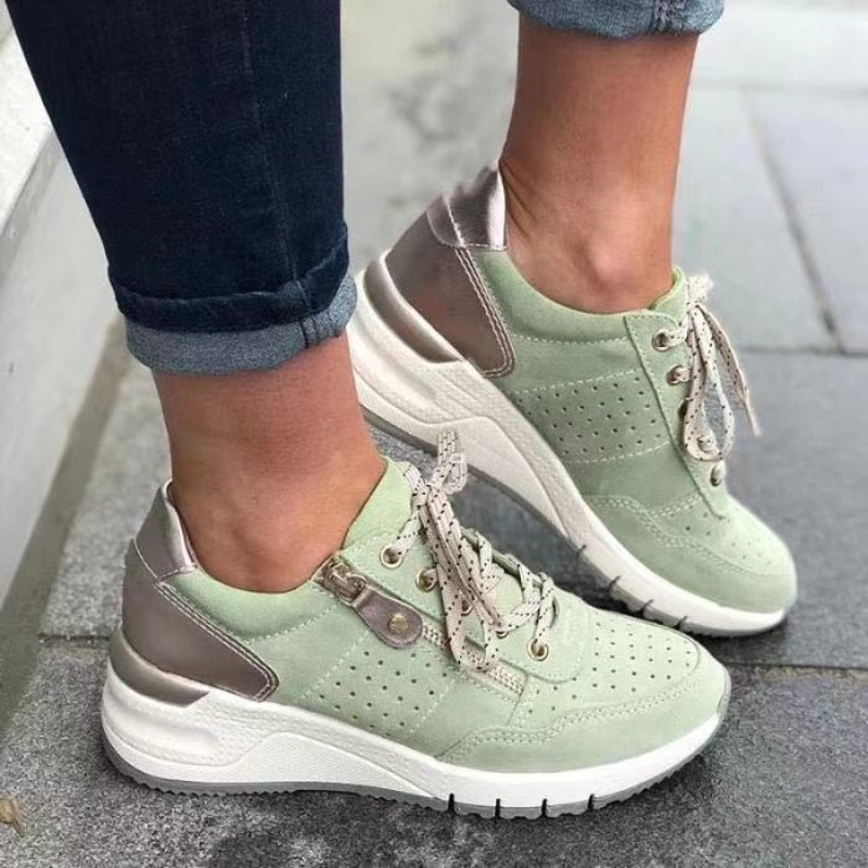 Women's lace-up wedge platform walking sneakers with side zip, perforated design for casual comfort.